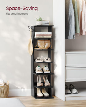 VASAGLE slim corner tower shelf in room shows efficient corner placement.