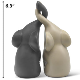 Vaudagio elephants in love beige-grey sculpture complements plants and vases for balanced vignettes.
