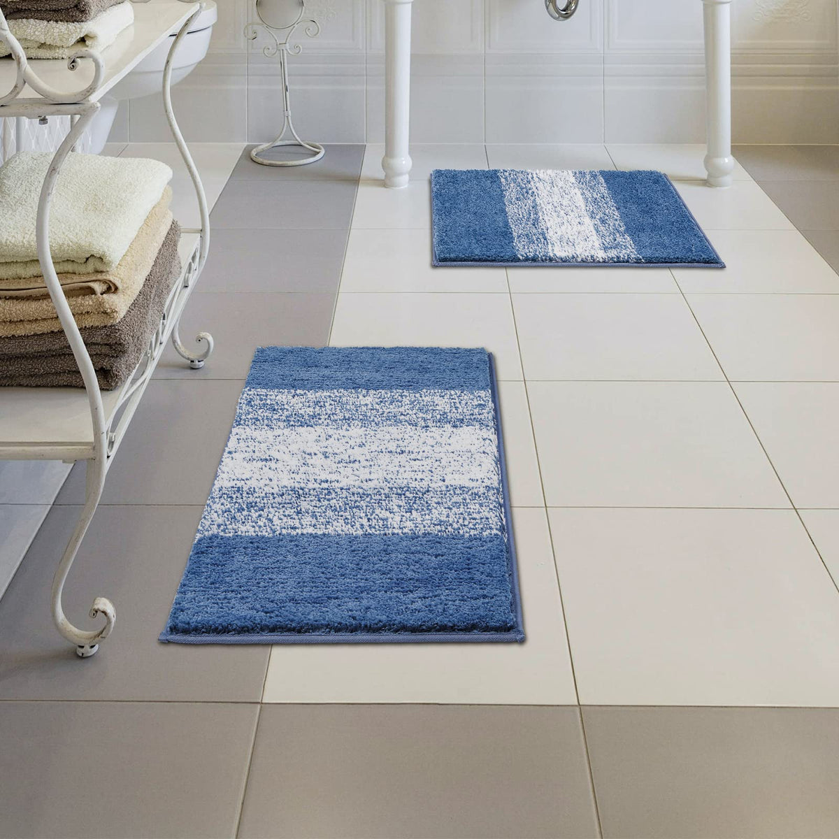Vaukki blue striped rug complements towels and decor.