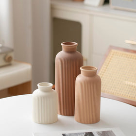 Vaurcesa ribbed matte brown vase serves as a bold room accent