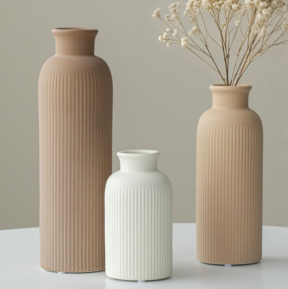Vaurcesa decorative vase stand-alone 3-piece set adds sculptural interest.