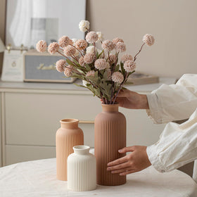 Vaurcesa light terra-cotta vase set introduces warm hues to shelves and tables