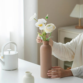 Vaurcesa matte finish ceramic vase with earth tones suits contemporary spaces.