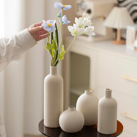 Vaurcesa beige dried-flowers display vase enhances decor.