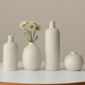 Vaurcesa sculptural-curve vase adds artistic focal point.