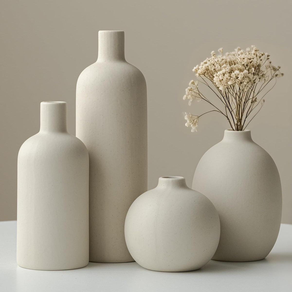 Vaurcesa tall beige ceramic vase from the set, perfect for a centerpiece.