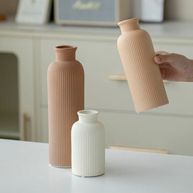 Vaurcesa vase set features ribbed texture in earthy coffee hues, enhancing shelf styling.