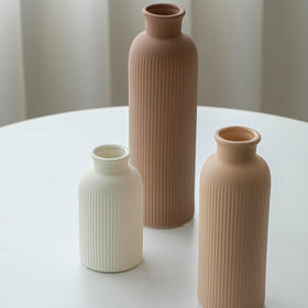 Vaurcesa ribbed texture vases in coffee tones add tactile detail for shelves.