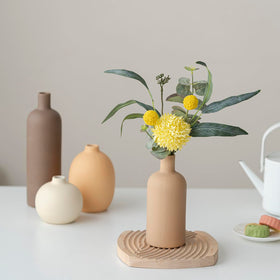 Vaurcesa varied-height ceramic vases create dynamic focal points on shelves