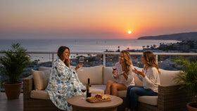 VCNY Home blanket draped over couch enhances living room ambiance