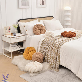 Hand-sewn finish on Vdoioe knot pillow offers durable, premium detailing.