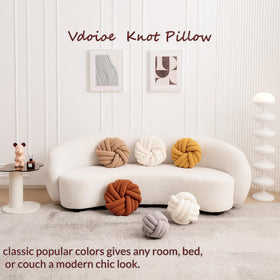Lamb wool texture close-up on Vdoioe knot pillow for warm, inviting texture.