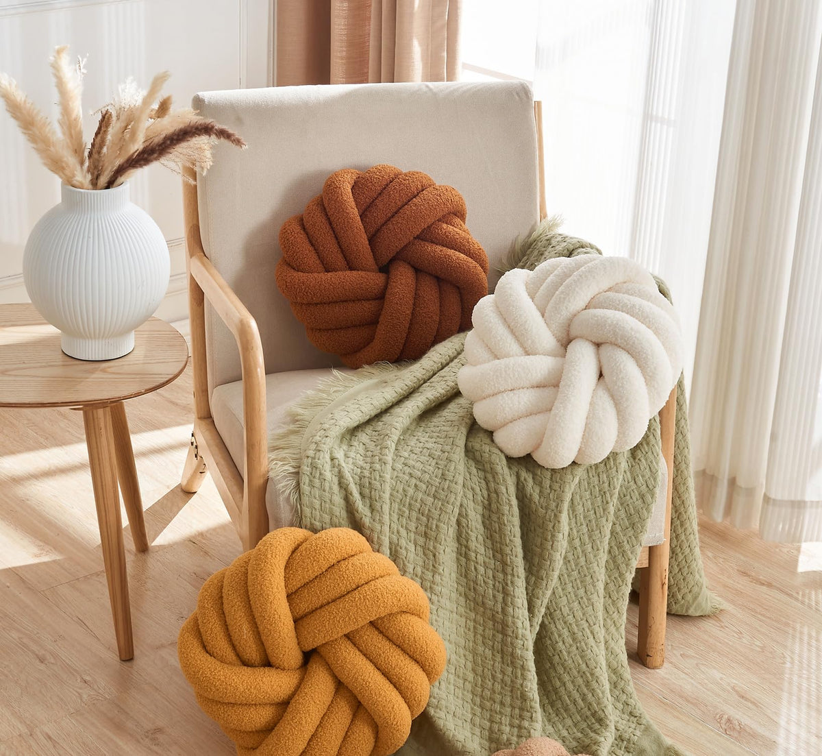 Soft ball-knit design from Vdoioe knot pillow enhances bed and couch decor.