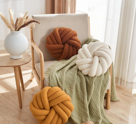 Soft ball-knit design from Vdoioe knot pillow enhances bed and couch decor.