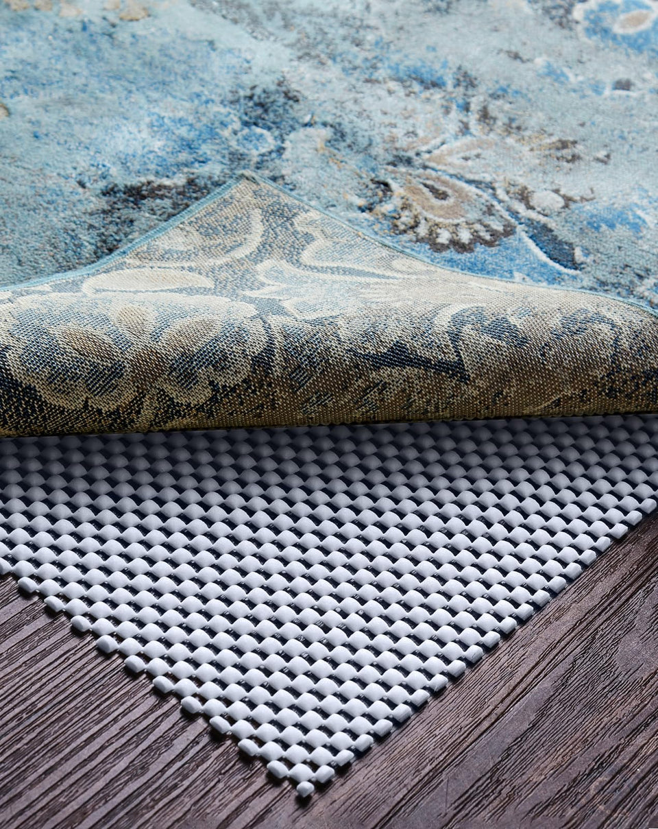 Veken rug pad gripper on hardwood floor keeps rug secure and protects surface.