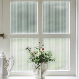 VELIMAX Reeded Glass Privacy Film on a frosted window providing privacy with light diffusion