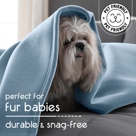 Vellux Original Queen blanket draped over chair for versatile home comfort.