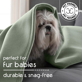 Vellux Original Queen Blanket draped over a sofa demonstrates lightweight all-season versatility