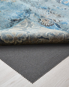 Veken rug pad gripper stabilizing a 6x9 ft rug on hardwood floors.