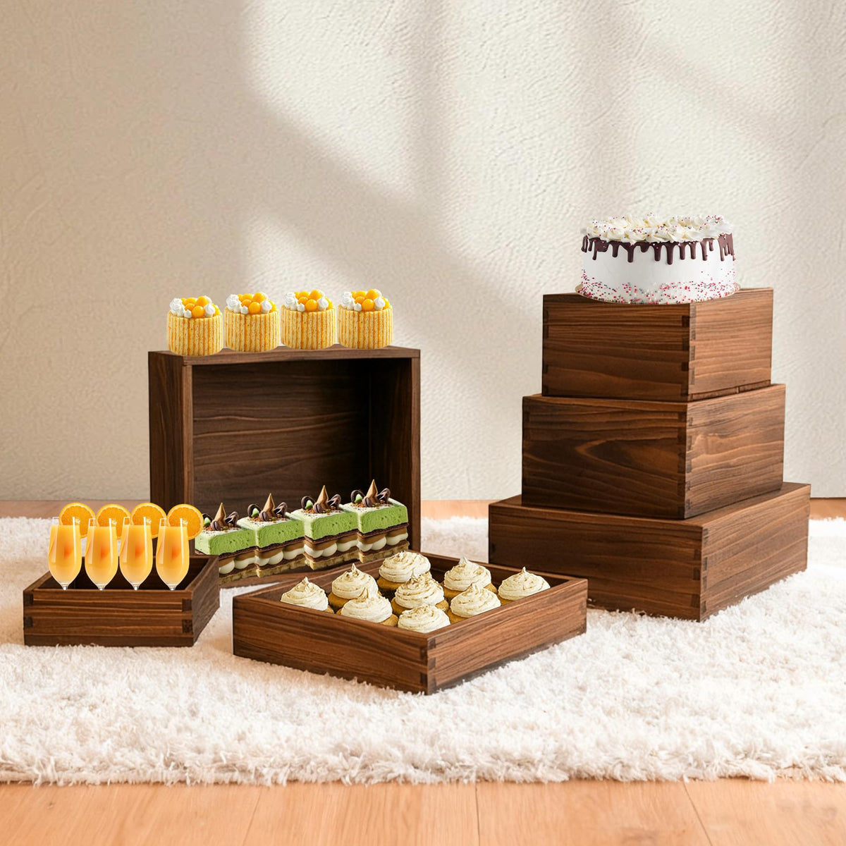 Verssure wedding dessert table setup featuring multi-height wood risers