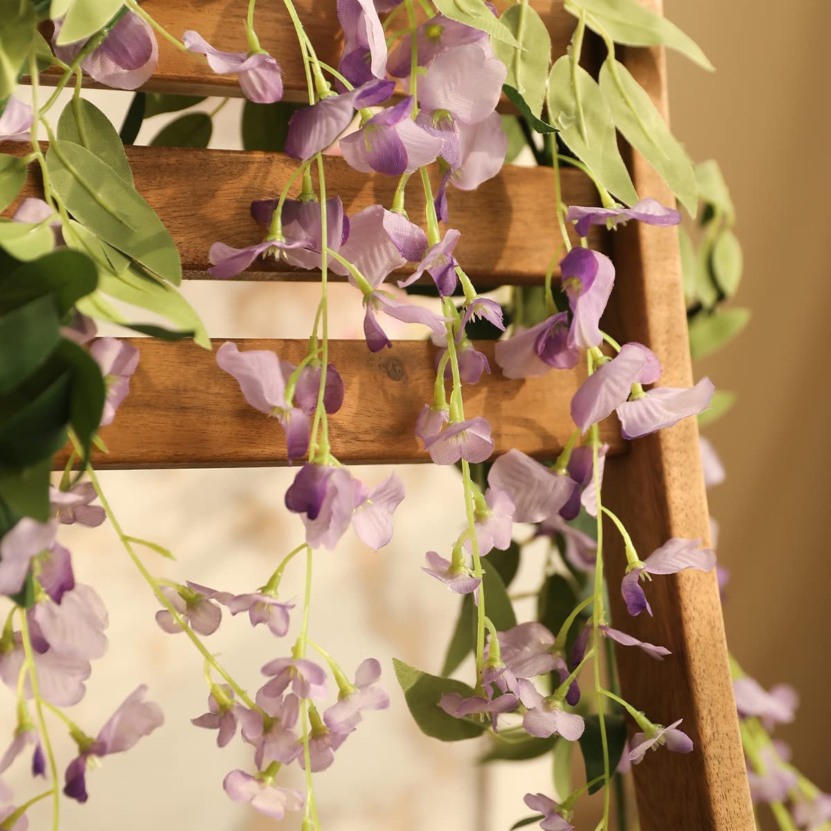 Veryhome wisteria garland hanging on wall creates romantic backdrop
