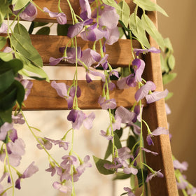 Veryhome wisteria garland hanging on wall creates romantic backdrop