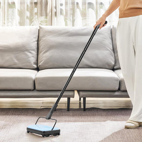 VEVOR carpet sweeper on hardwood floor, effective crumb collection.