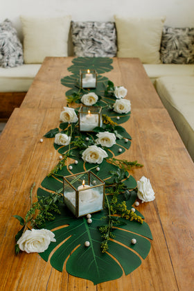 Vibe tropical palm leaves elevate Hawaii themed parties with vibrant, reusable decor.