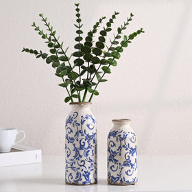 Victor & Teresa blue-white ceramic vase close-up glaze highlights artisan texture.