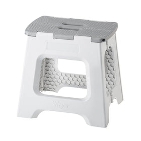 Vigar compact folding stool closed, space-saving storage beside cabinets