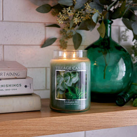 Village Candle apothecary jar in green glass on a mantel highlighting calm fragrance