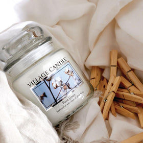 Village Candle Pure Linen dual-wick burn provides even fragrance release across a space.