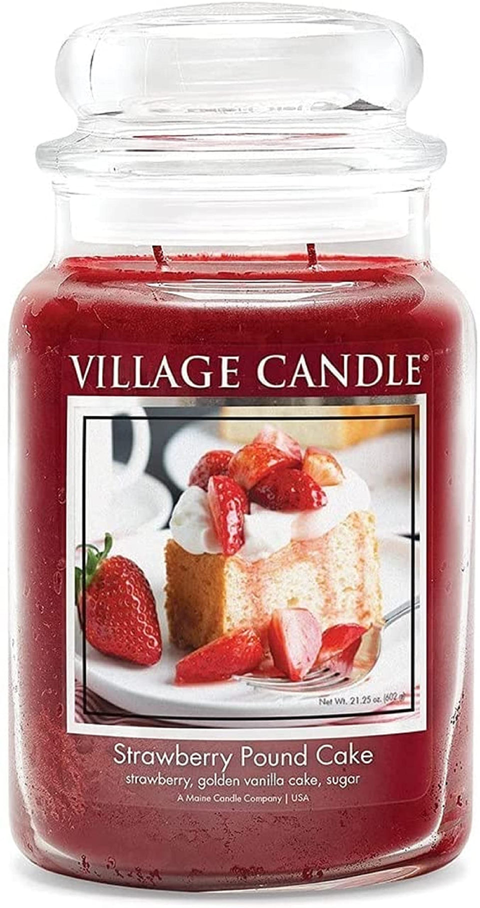 Village Candle Strawberry Pound Cake red apothecary jar candle on shelf for cozy fragrance.