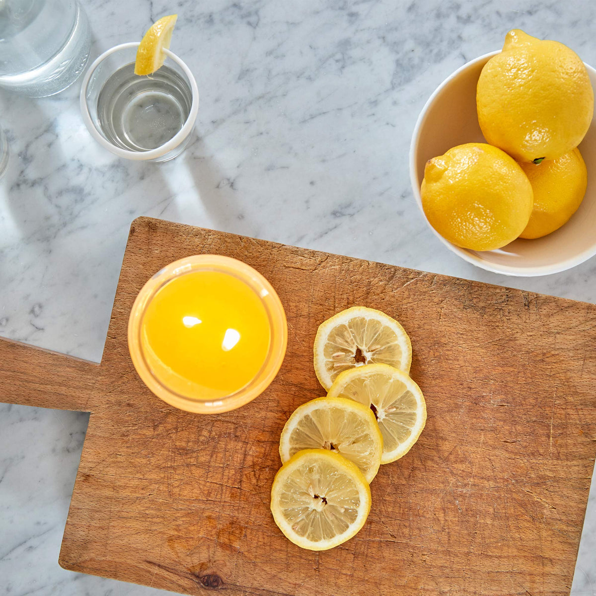 Village Candle vibrant yellow glass jar adds sunny decor and mood-lifting fragrance.