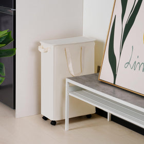 Vincona beige slim hamper in a bedroom setting for neat storage