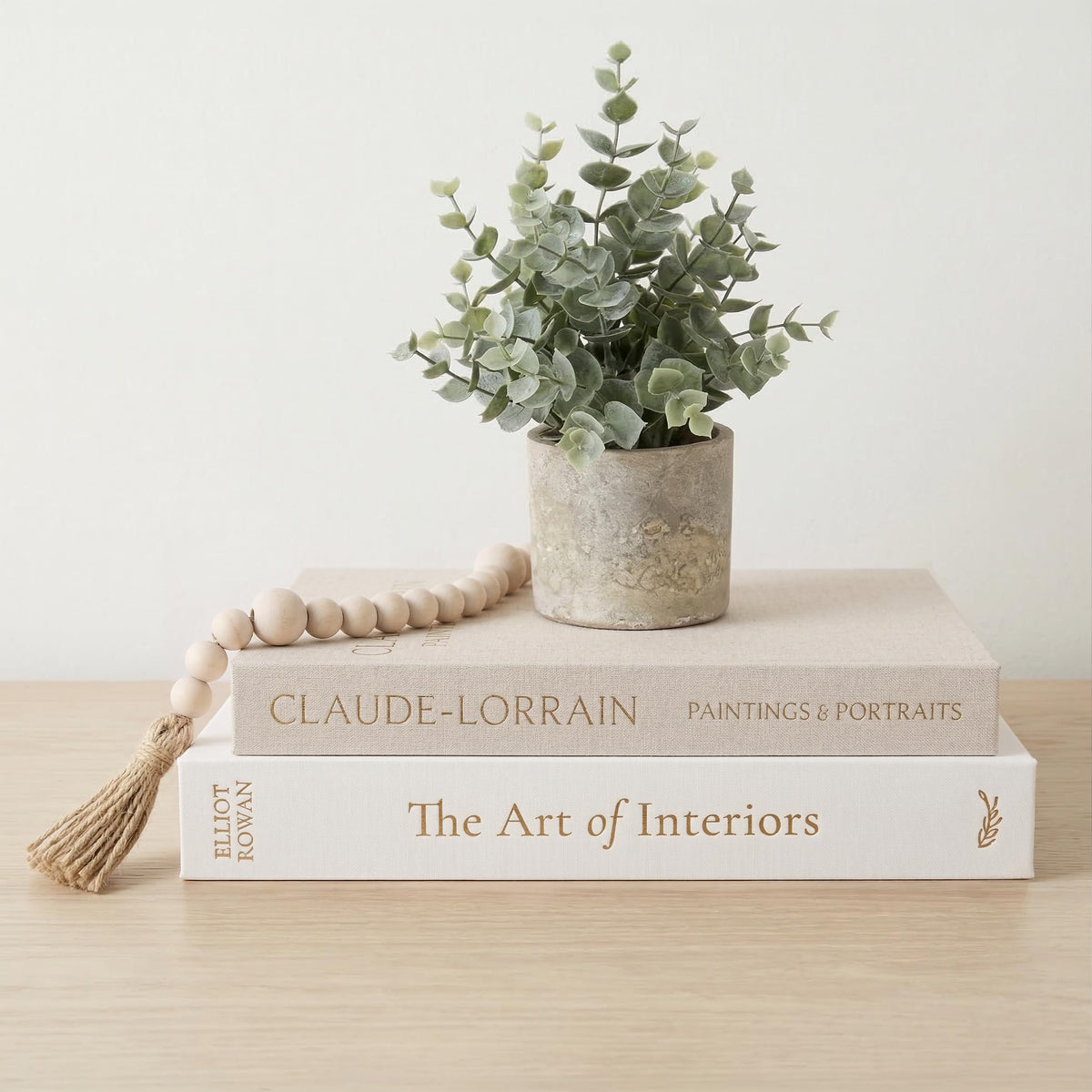 Vine Creations decorative books large box on a shelf adds elegant storage.