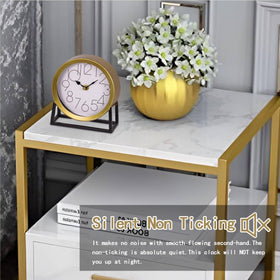 VinSees gold table clock close-up shows glass and metal finish.