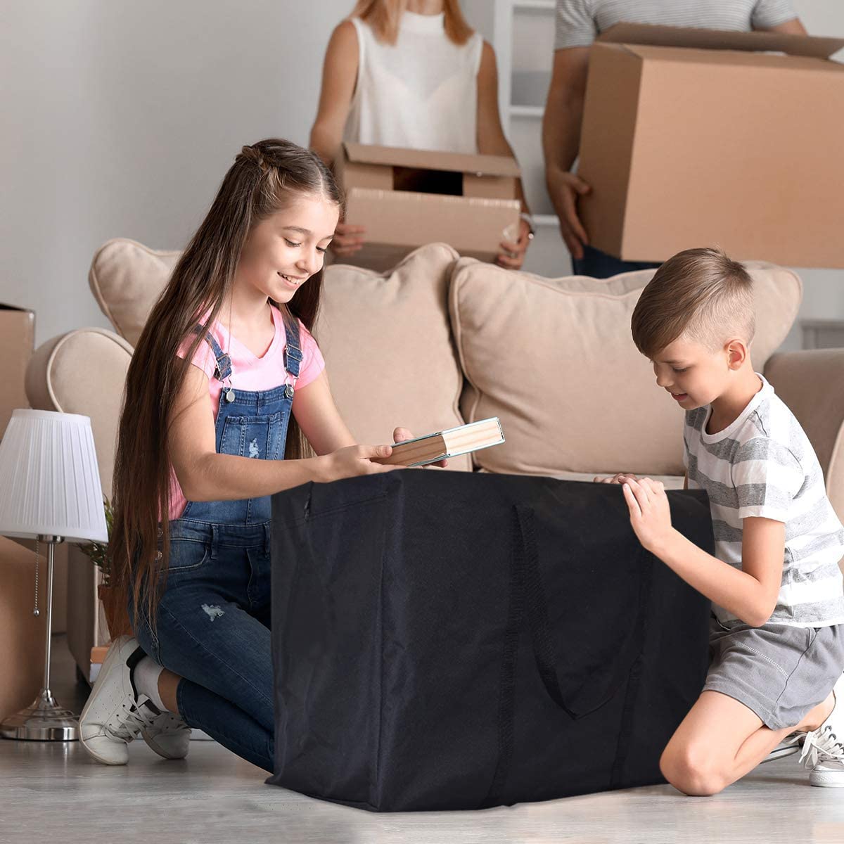 Vioetry clothes, towels, and blankets packed neatly in oversized totes