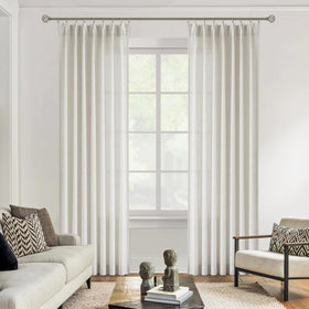 Vision Home pinch-pleated curtains provide refined privacy with two panels.
