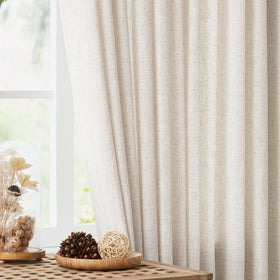 Vision Home pinch-pleated curtains with weighted hems create elegant drape.