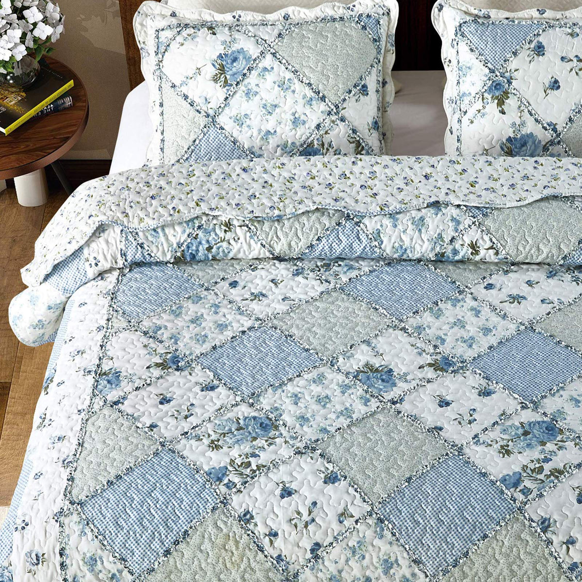 VIVILINEN blue patchwork quilt on bed; ready for year-round layering.