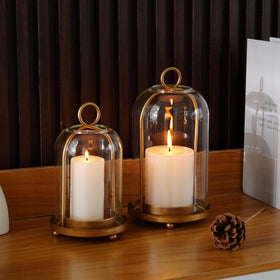 Set of two VIVIRENOIR candle holders displayed together on a mantel.