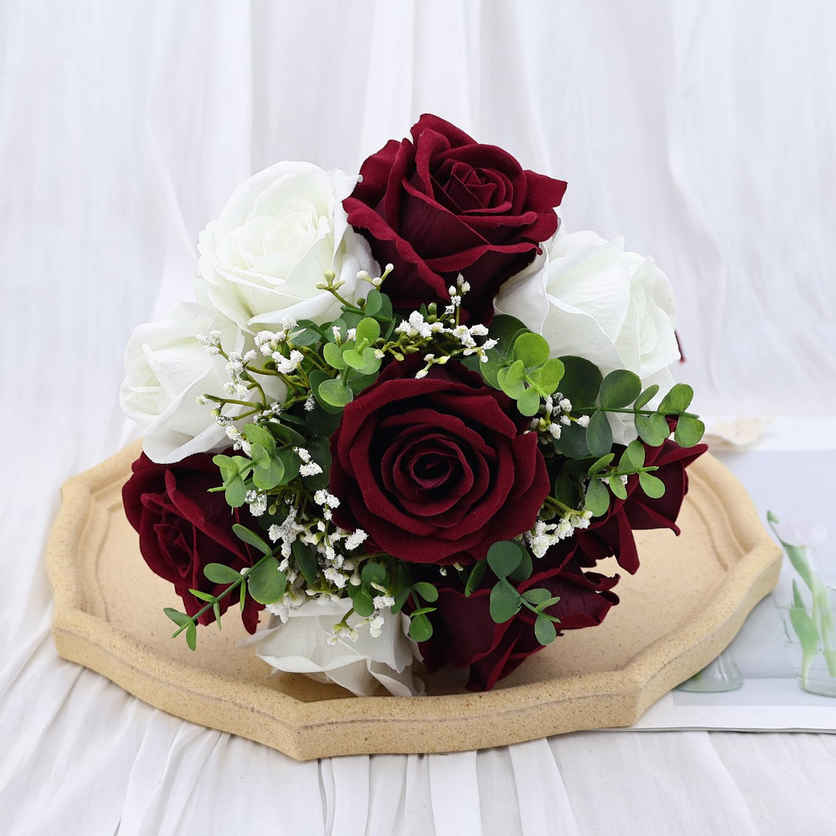Vkkperp lace and jute ribbon on bouquet handle adds texture.