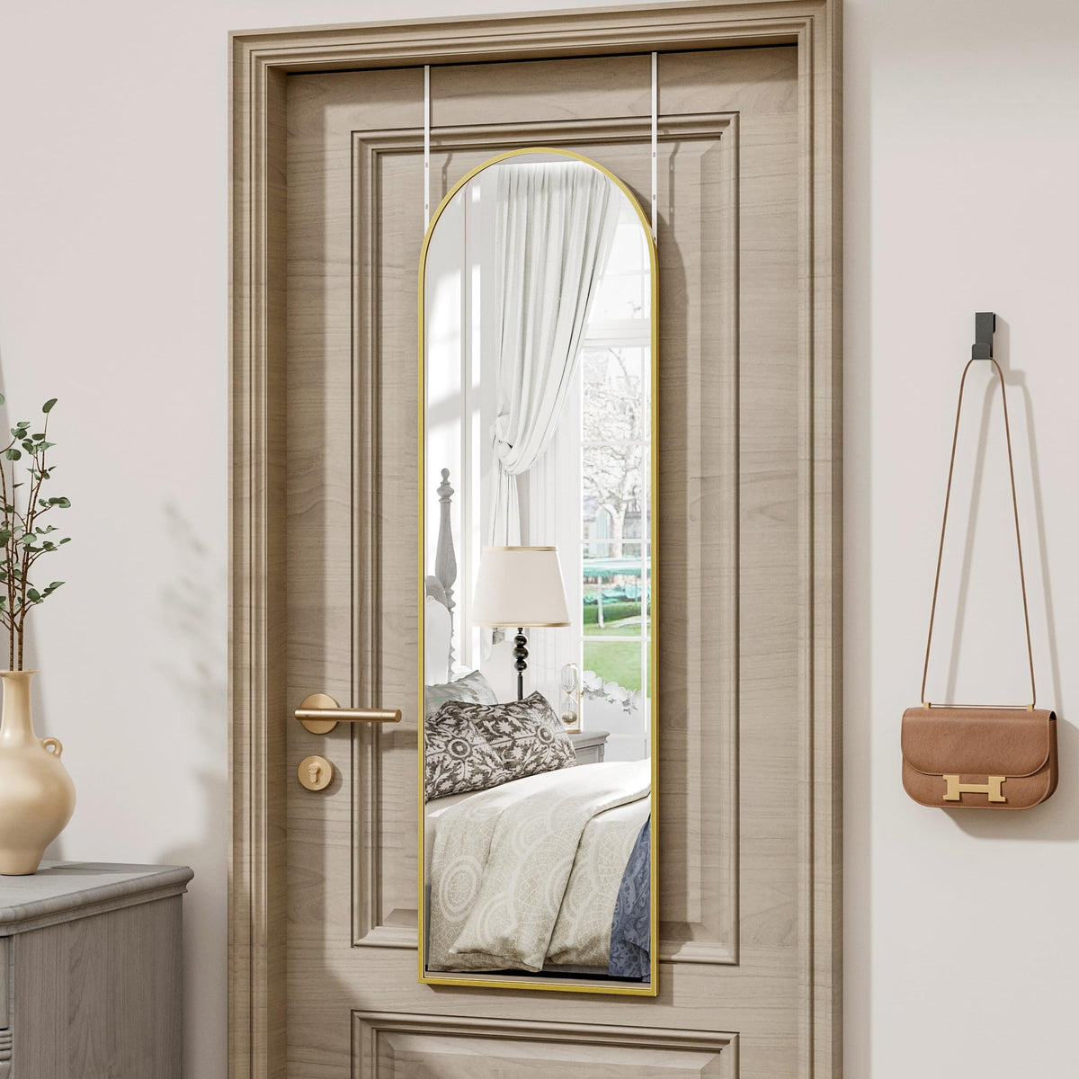 Vlush full-length mirror over the door in gold for outfit checks.