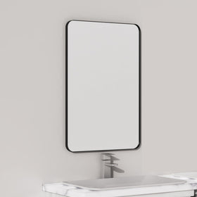 VocalStar black metal framed mirror over vanity adds farmhouse style.
