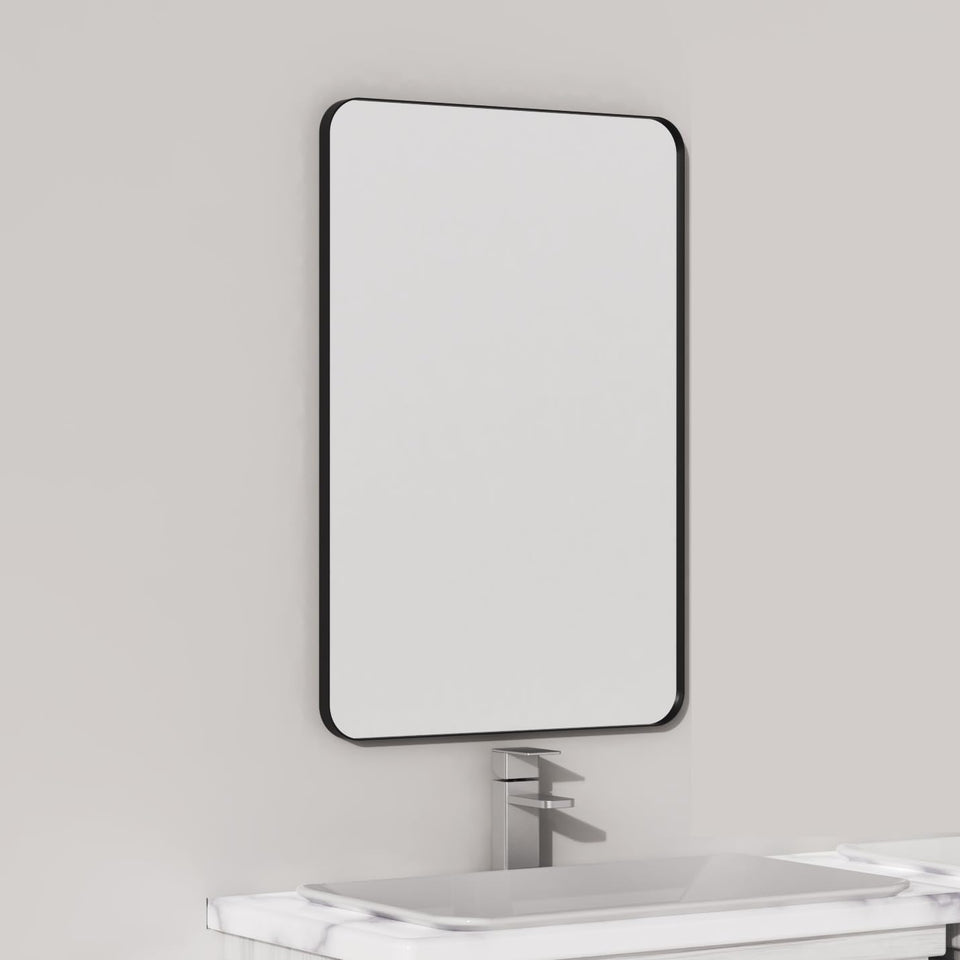 VocalStar black metal framed mirror over vanity adds farmhouse style.
