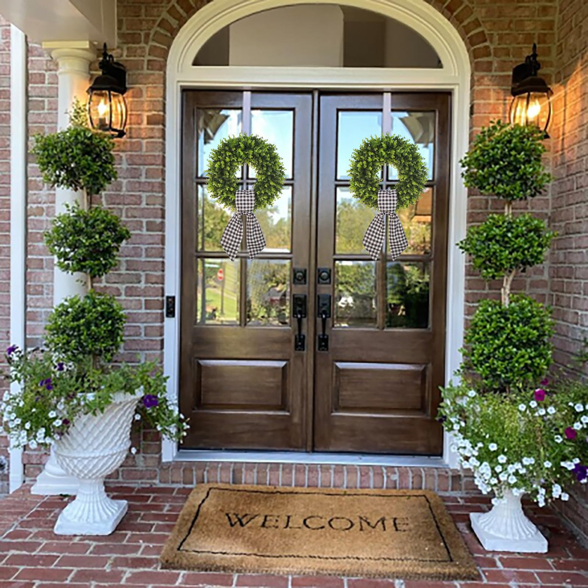 Vofuly wreath on an exterior wall adds seasonal warmth with buffalo sash.
