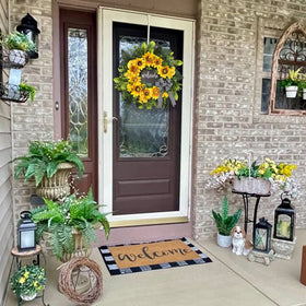 Vofuly artificial sunflowers wreath with green foliage brightens entryways.