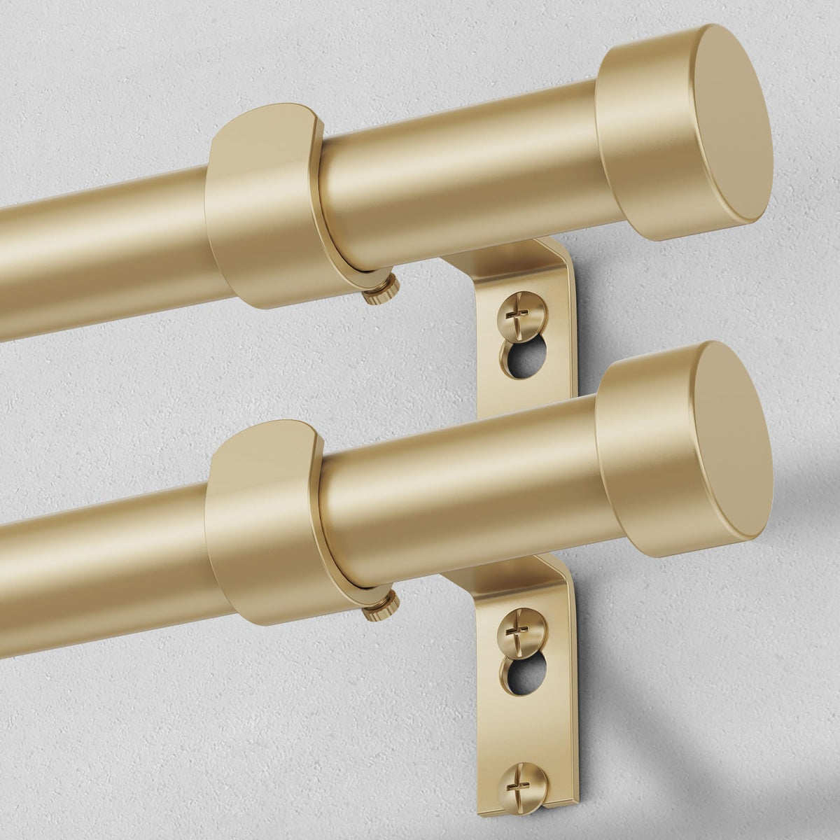 VOIIY 2-pack gold curtain rods with decorative end caps for a modern look.