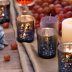 Navy-gold trimmed votives add timeless sophistication to celebrations